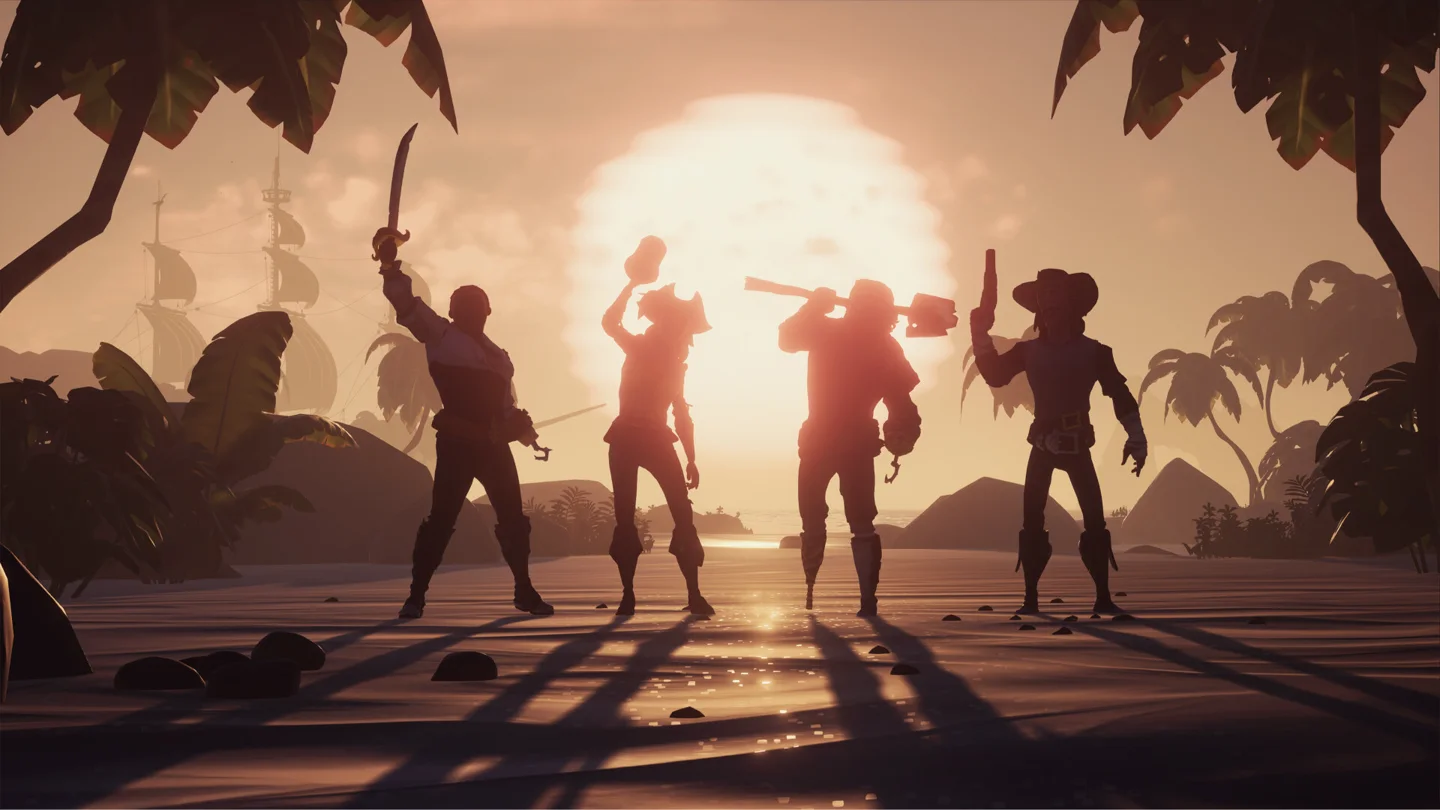 A pirate crew raises their arms together at sunset in Sea of Thieves